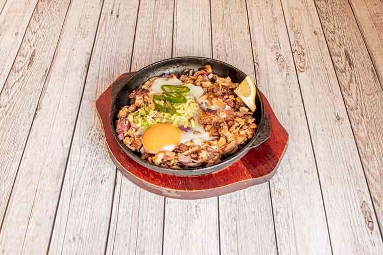 Sisig is a Filipino food of Pampanga origin. It is made with pig